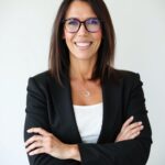 Shauna Griffiths SLG Impact CEO Wearing Glasses and a Black Blazer.